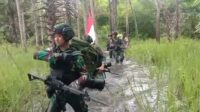 Meski Medan Sulit, Satgas Yonif 123/RW Patroli Cek Patok Batas Negara RI-Papua Nugini